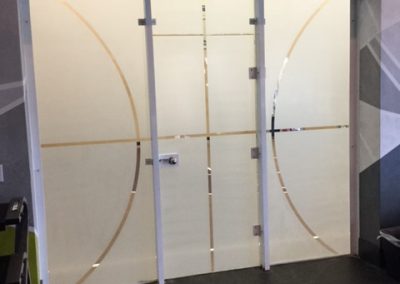 White frost window film on gym doors with basket ball pattern cut out