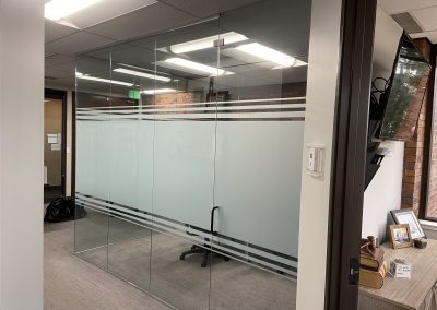 Conference room privacy window film band with large middle stripe and small top and bottom stripes