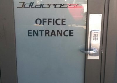White frost window film on door with office logo cut out