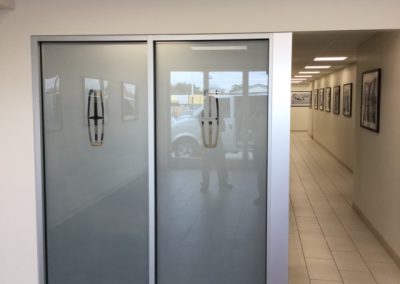 Frost window film with Lincoln automobile logo removed