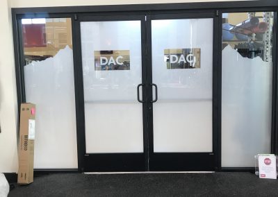 White window film with logos removed and mountain scene pattern at the top