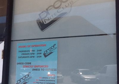 White frost film on glass with night club logo cut out