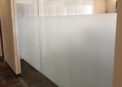 White frost window film band on conference room windows