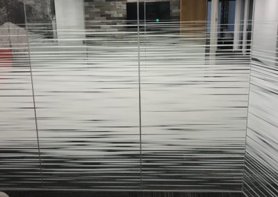 Solyx Dual Motion Gradient decorative window film installed on corner office glass