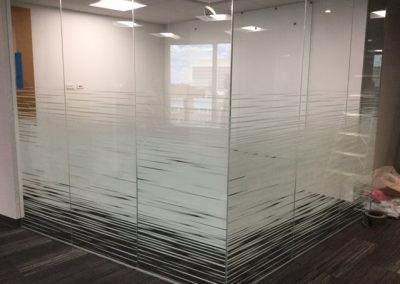 Solyx Dual Motion Gradient decorative window film installed on corner office glass