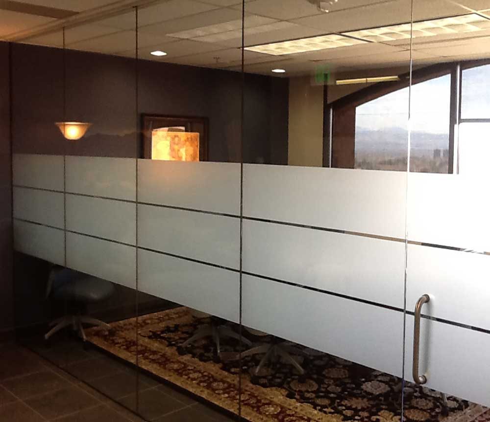 Three privacy window film bands installed on conference room glass